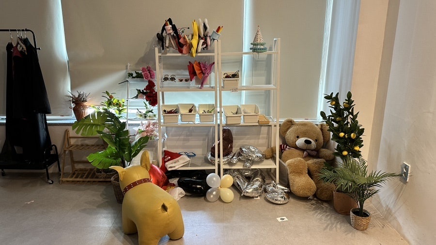 Props and chairs arranged beside the self-service studio backdrop