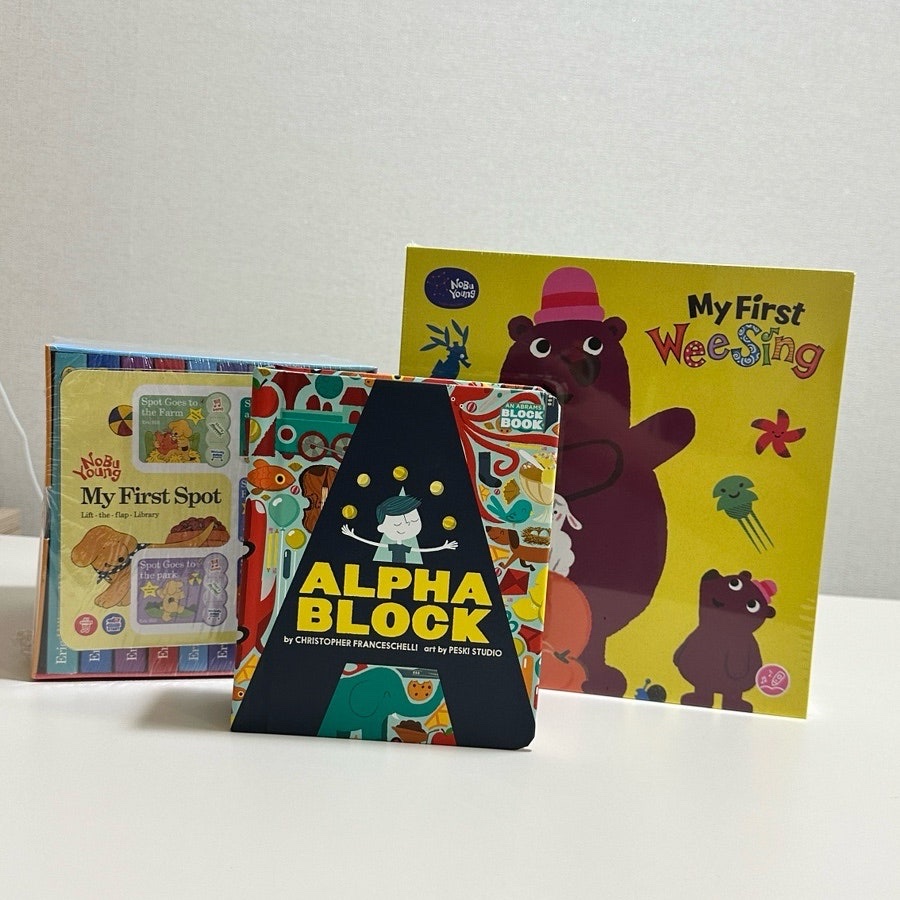 Three English picture books from the set standing upright