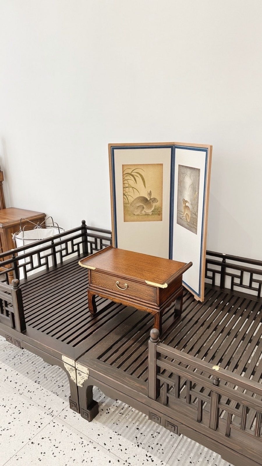Traditional wooden furniture in the small room behind the first-birthday table