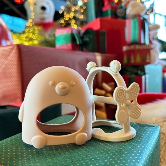 Silicone teether separated into its glove and wrist configurations